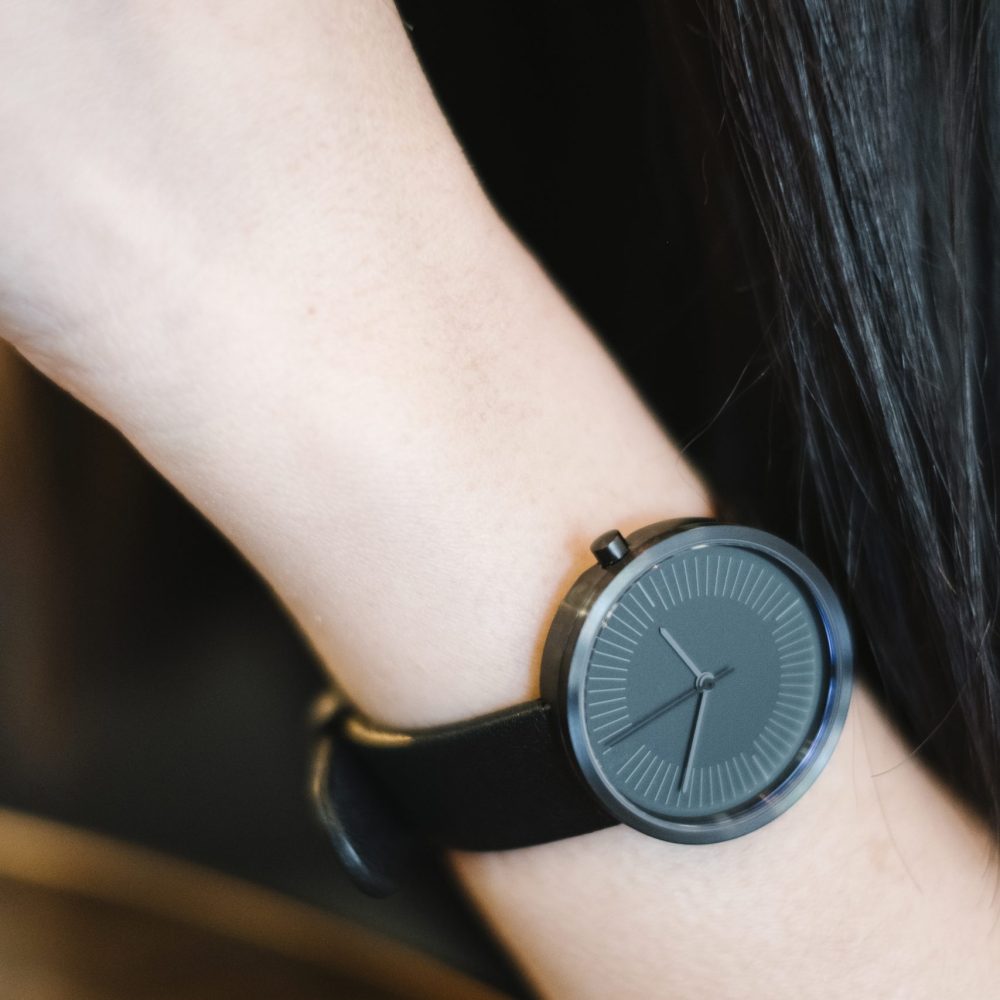 minimal classic black watch on girl hand